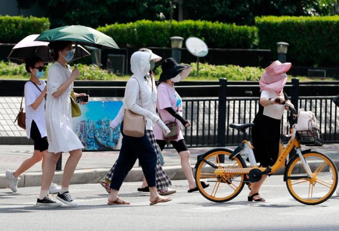 一年中最热时段到来 高温打卡日历看哪里热到高温全勤